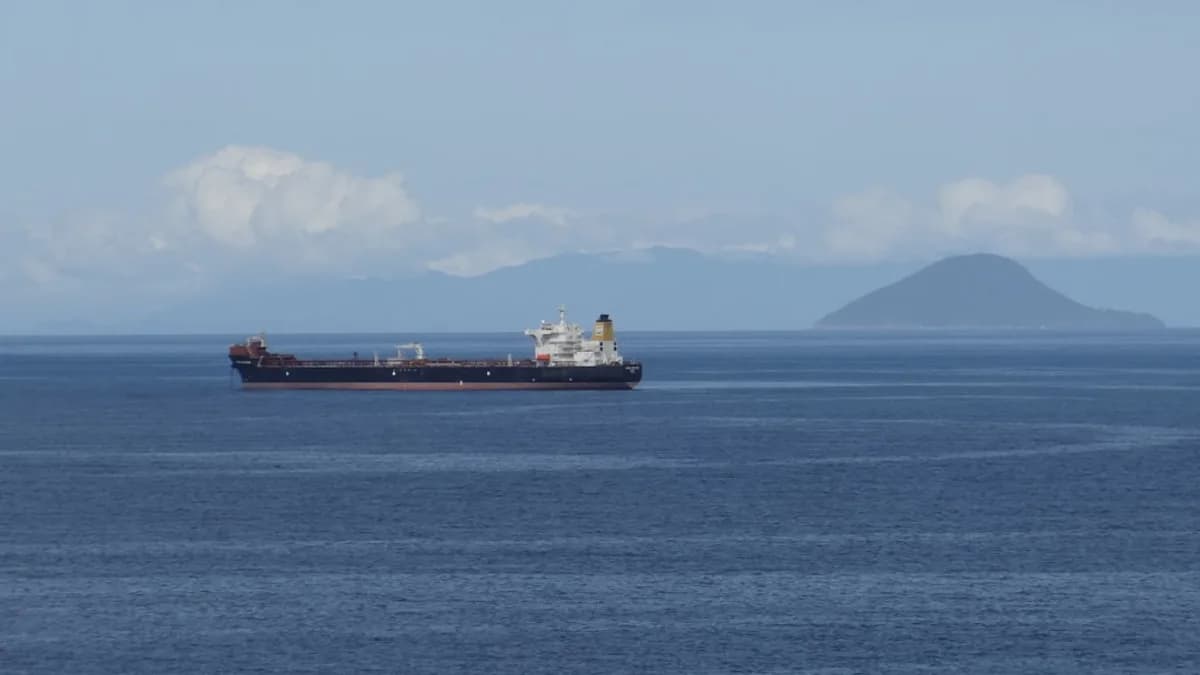 a large cargo ship in the middle of the ocean