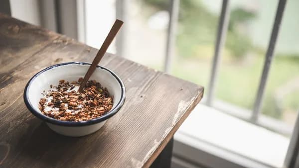brown wooden chopsticks on white ceramic bowl
