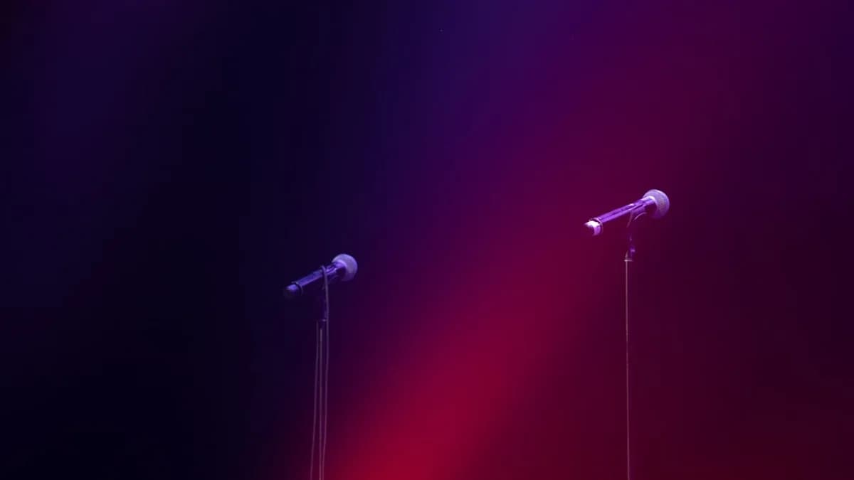 a couple of microphones sitting next to each other on a stage
