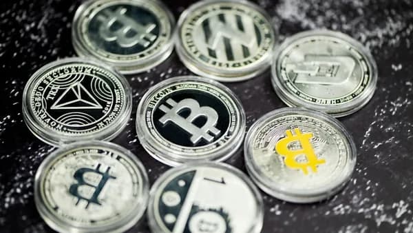 a pile of bitcoins sitting on top of a table