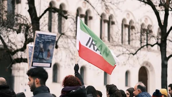 a crowd of people standing in front of a building