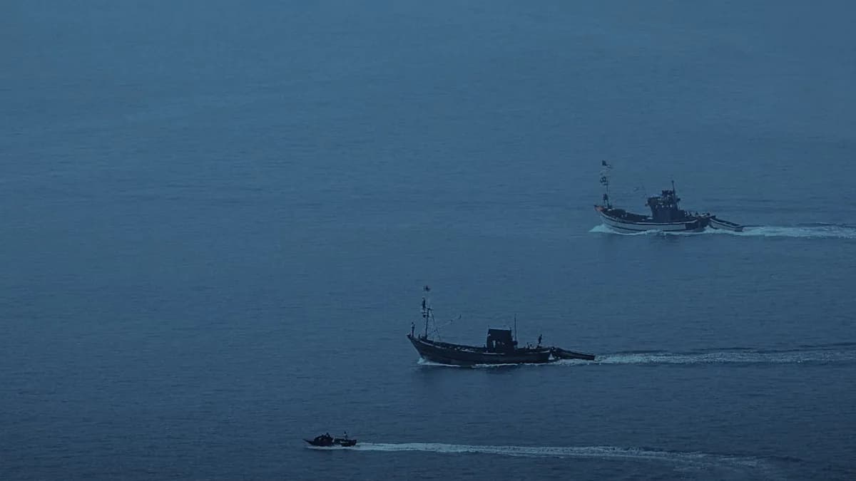 A couple of boats that are in the water