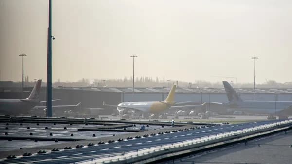 an airport filled with lots of parked airplanes