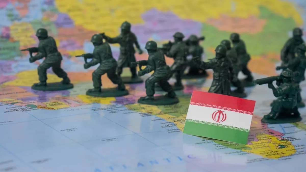 Toy soldiers on a map with iran flag.