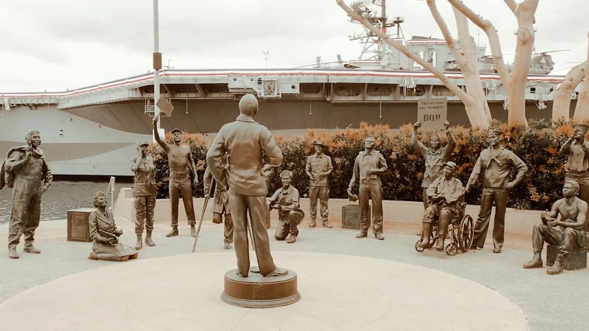 people in brown and beige uniform standing on white concrete floor during daytime