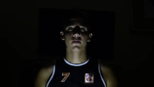 man wearing black New York jersey shirt