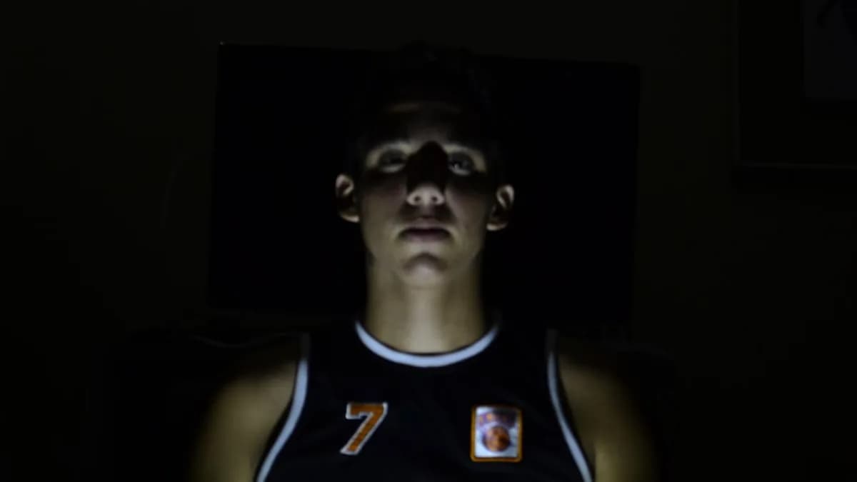 man wearing black New York jersey shirt