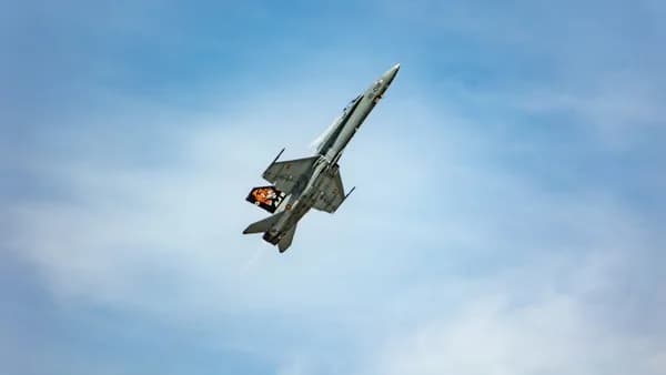 a fighter jet flying through the air