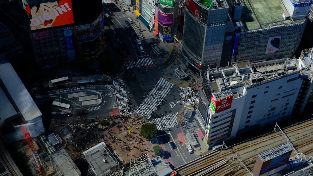 Aerial view of a busy city intersection with buildings.