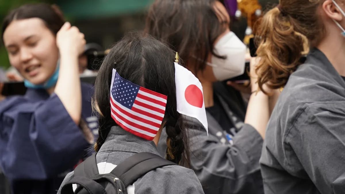 a group of people standing around each other