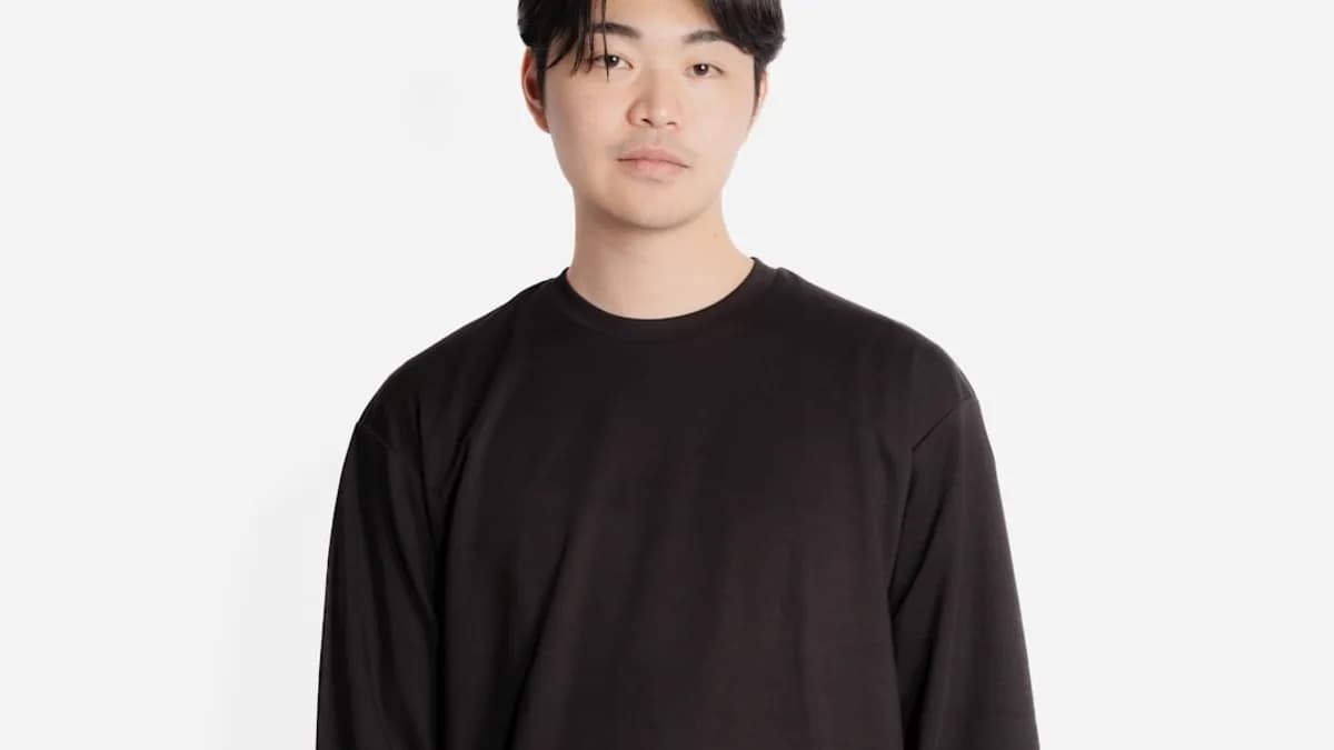 a man standing in front of a white background