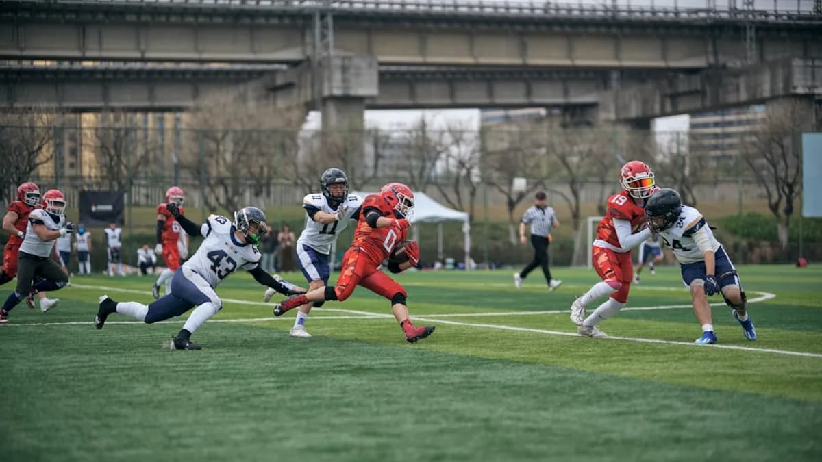 Players in a football game on a field