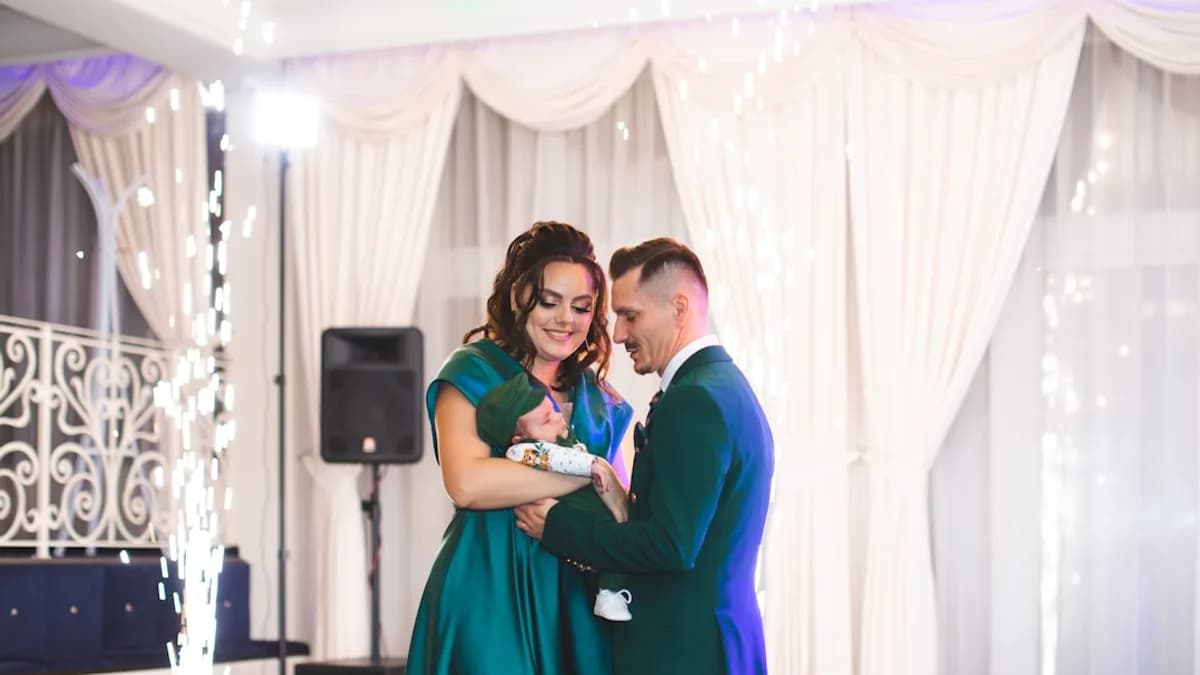Couple embracing with sparklers at a formal event