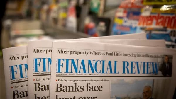 newspapers are stacked on top of each other