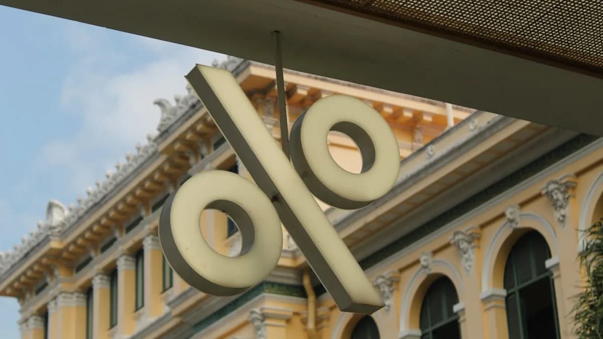 A sign hanging from the side of a building