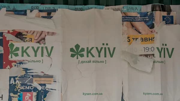 A bunch of t shirts hanging on a wall