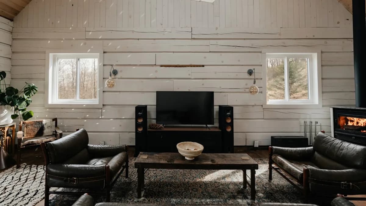a living room filled with furniture and a fire place