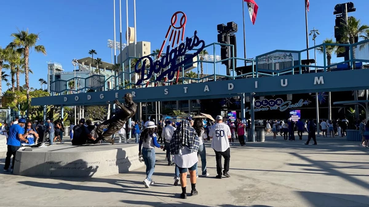 People entering dodger stadium before a game.