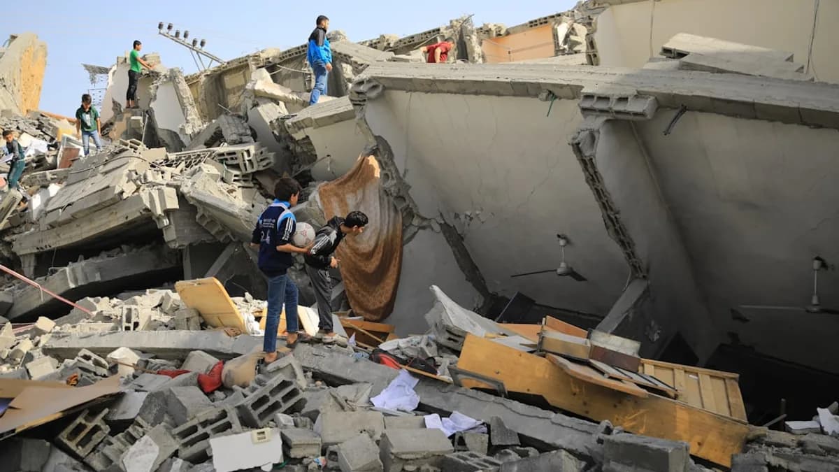 a group of people standing next to a collapsed building