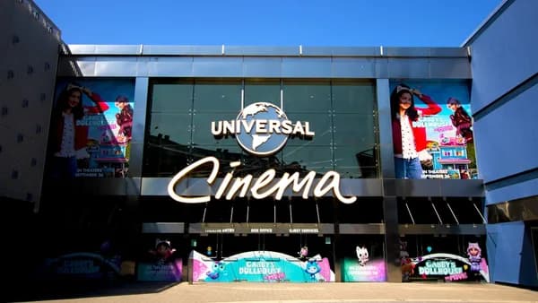 Exterior of a universal cinema building on a sunny day.