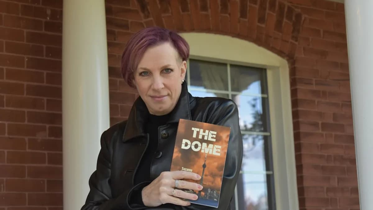 woman in black coat holding book