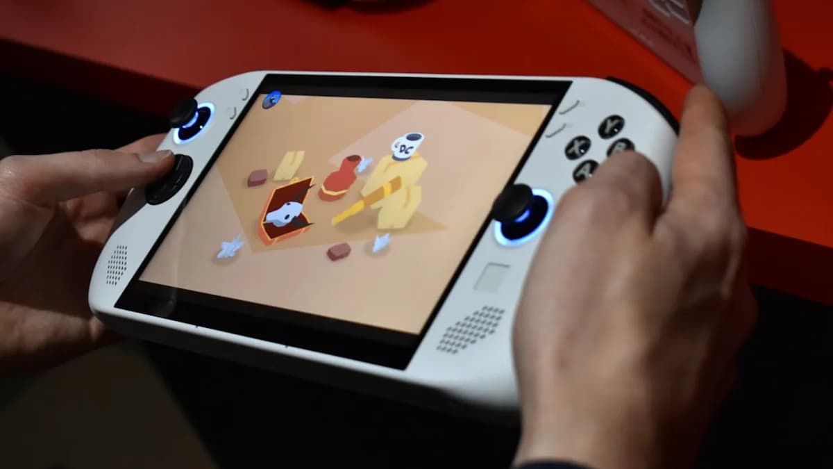 Person playing a handheld gaming device with colorful screen