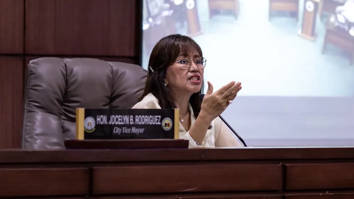 City mayor jocelyn r. rodriguez speaks at a meeting.