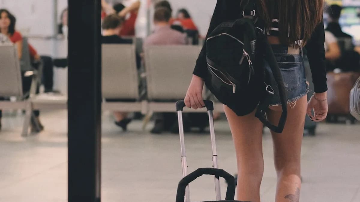 woman holding luggage