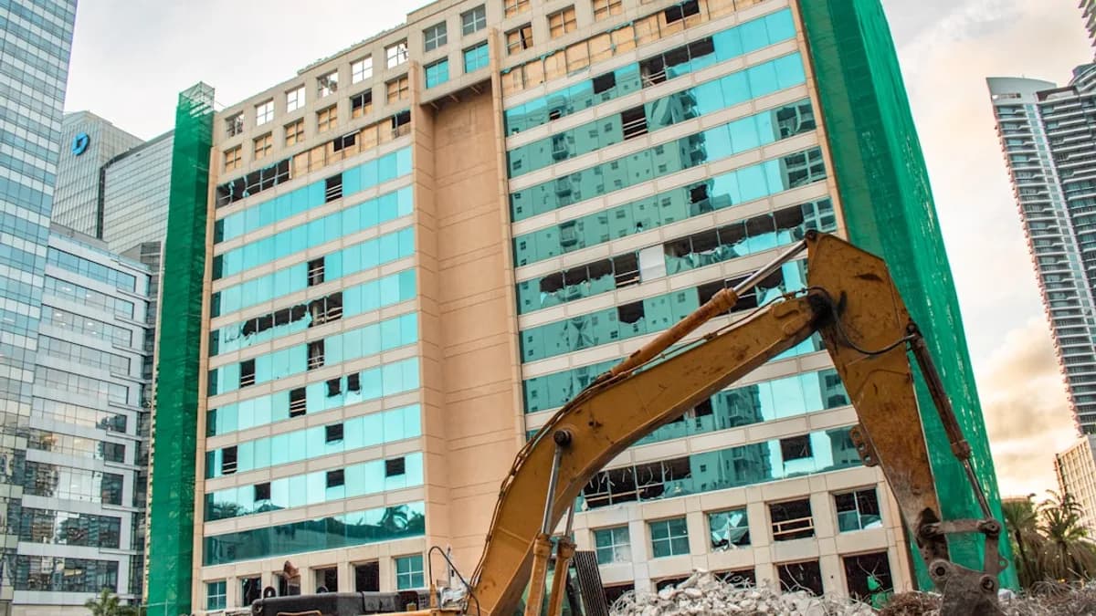 Construction equipment working on a high-rise building.