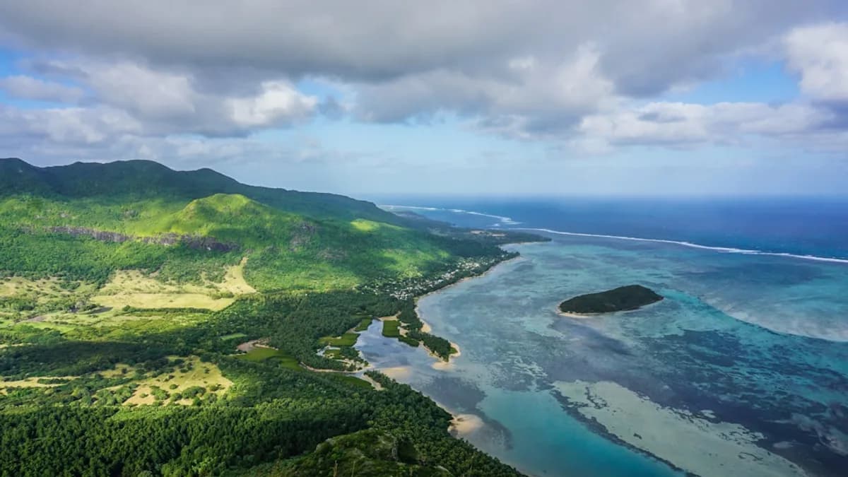 an aerial view of the ocean and land