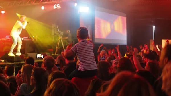 people watching band performing on stage