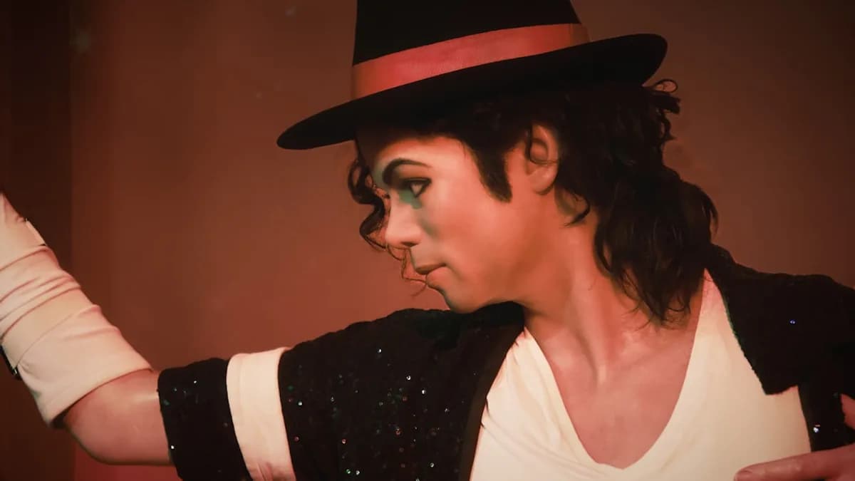 a man in a top hat and black jacket