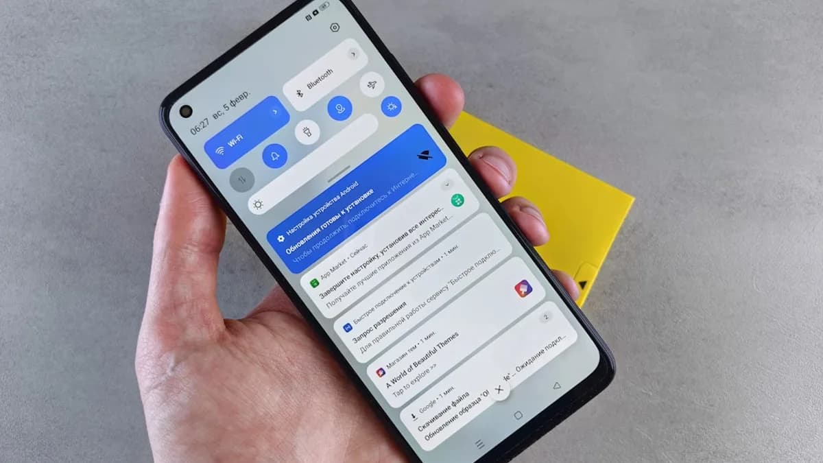 a person holding a cell phone in their hand