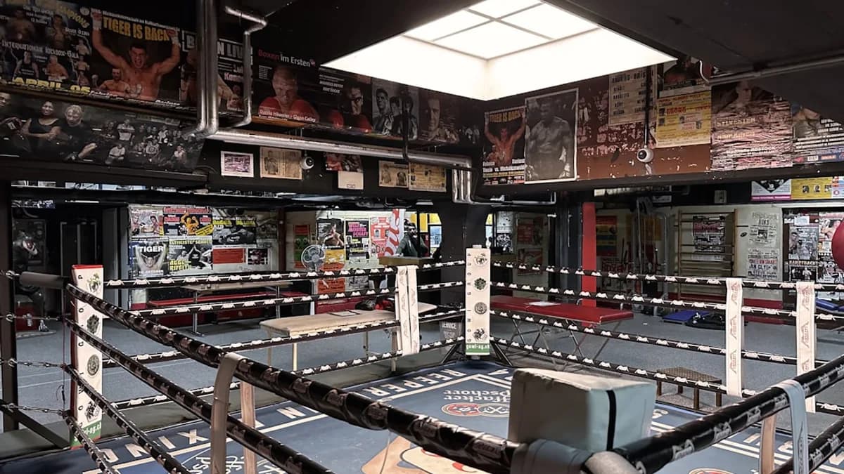 a large room with many signs and a large metal object in it