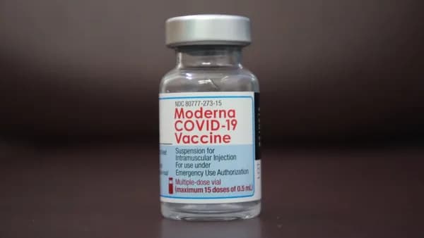 a close up of a bottle of medicine on a table