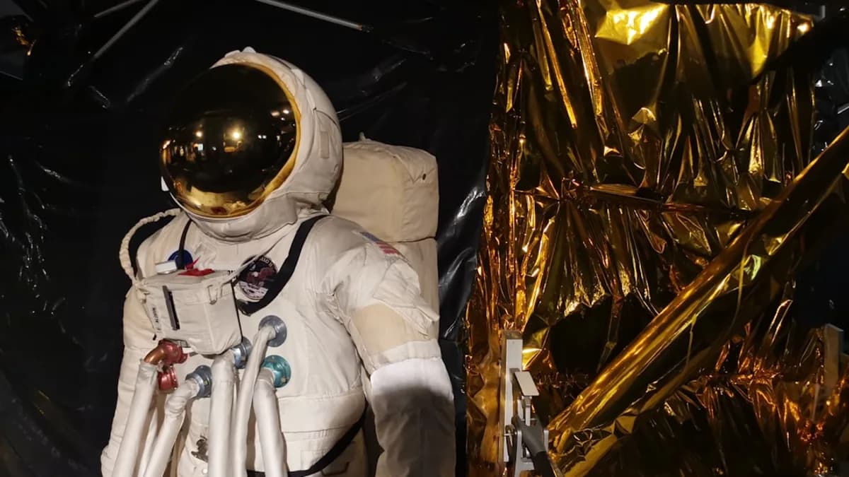 man in white suit wearing white helmet