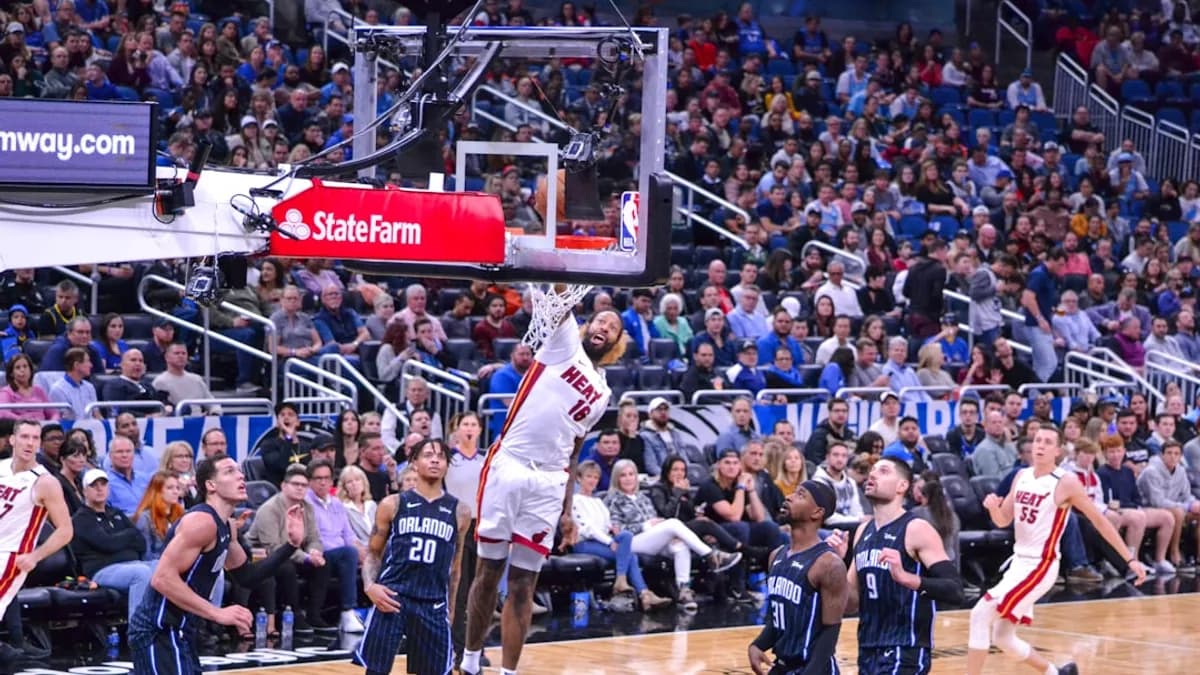 man in white jersey shirt playing basketball