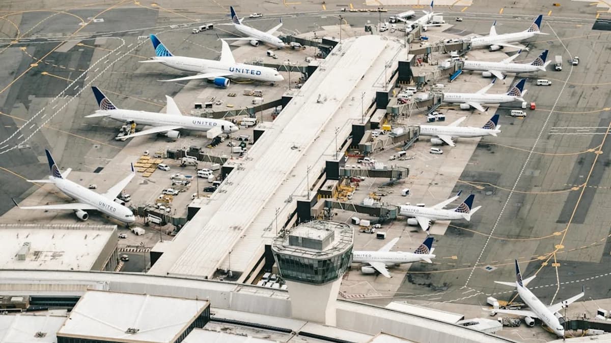 white and gray airplane on airport during daytime