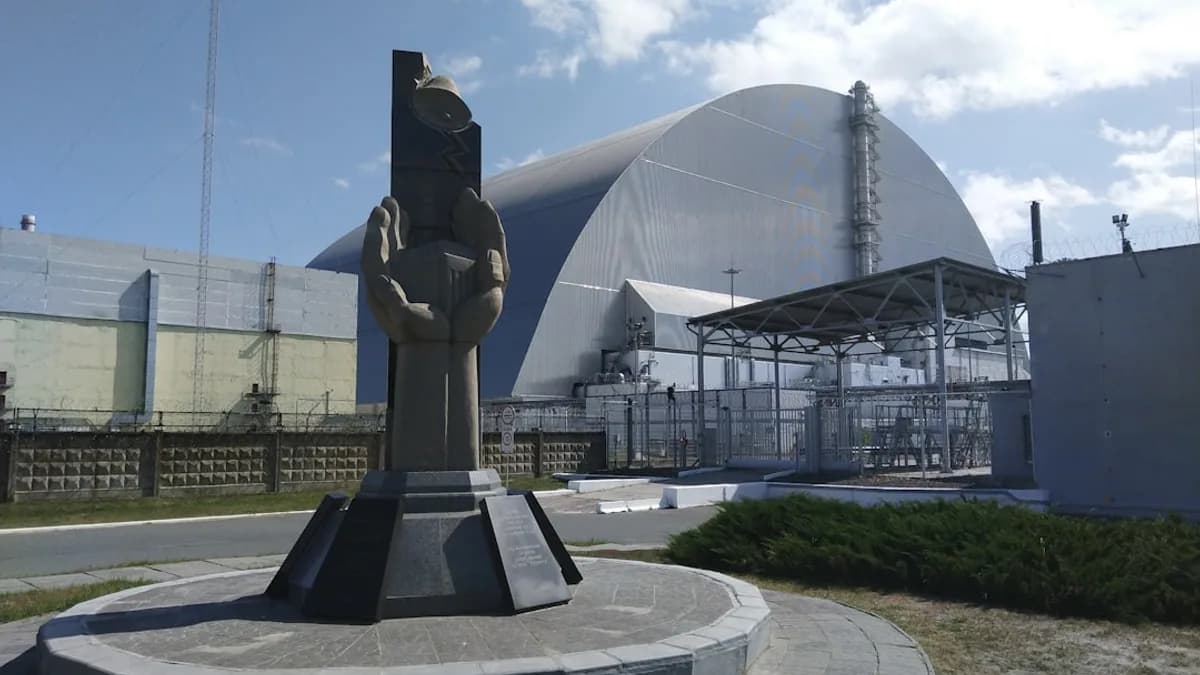hand concrete sculpture beside road