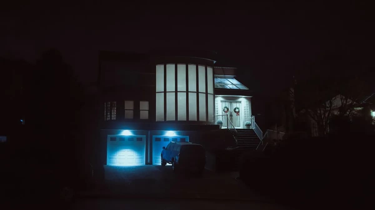 Modern house with blue lights at night