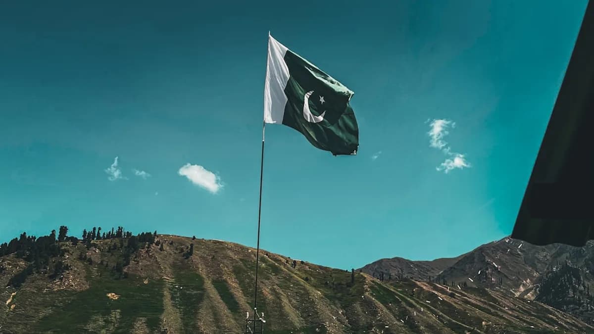 a flag flying on top of a mountain