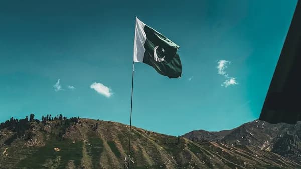 a flag flying on top of a mountain