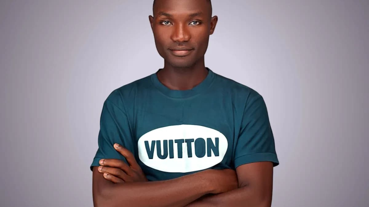 A man with his arms crossed and a sign that says vutton on it