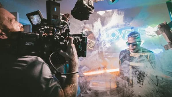 man holding camera while filming