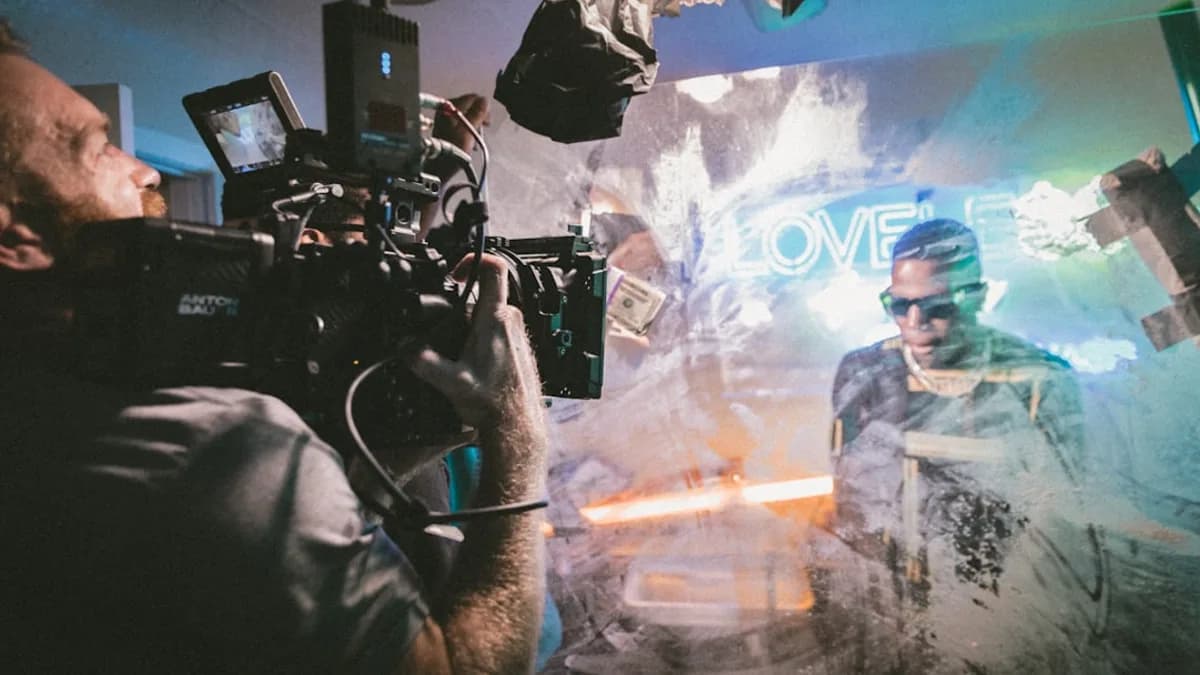 man holding camera while filming