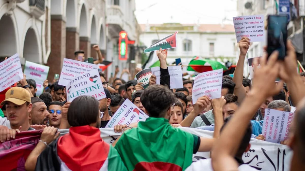 a large group of people holding up signs