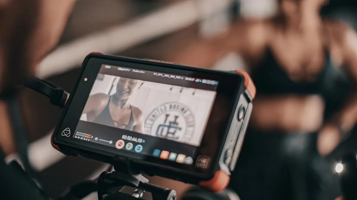 black camera viewing woman smiling