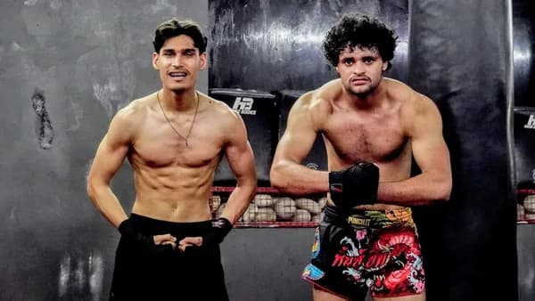 A couple of men standing next to each other