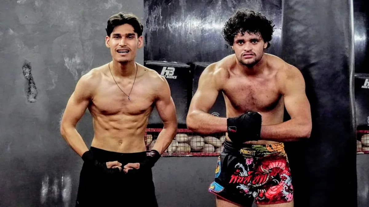 A couple of men standing next to each other