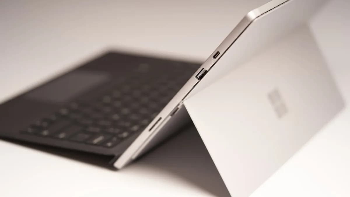 black ipad with keyboard on white table